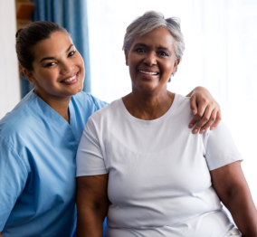 caregiver and senior smiling