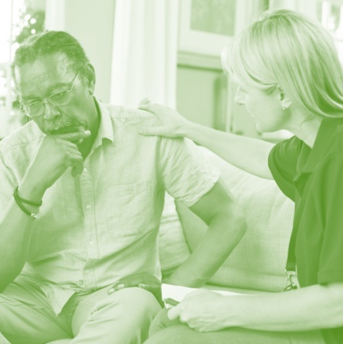 senior comforted by woman