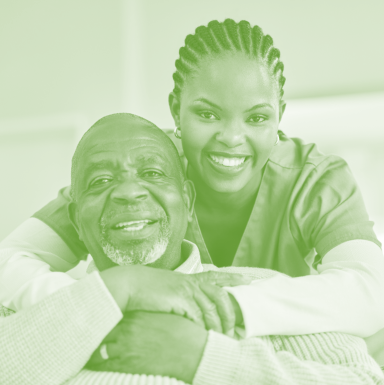 caregiver hugging senior