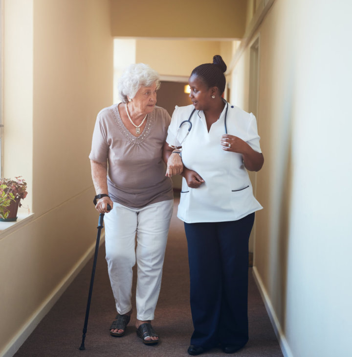 caregiver walking with senior