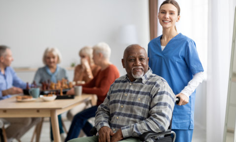 senior patient and the caregiver smiling