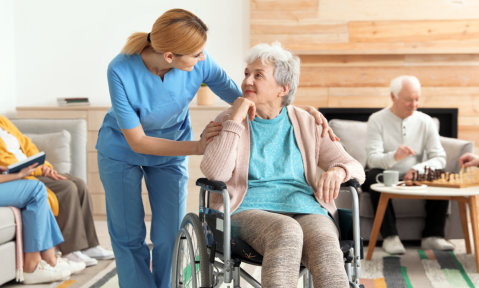 senior patient and the caregiver smiling