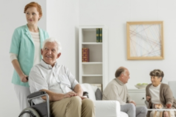 caregiver with senior on wheelchair