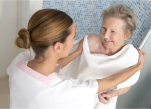 caregiver bathing senior