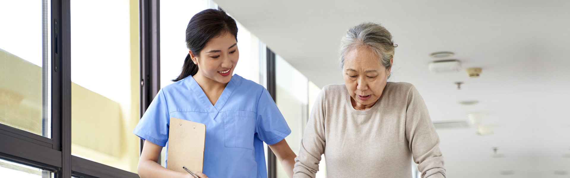 caregiver walking with senior